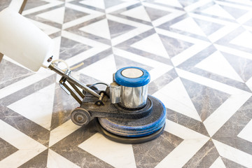working polisher on marble floor