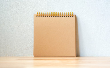 Blank notepad brown color for copy space on the table wood