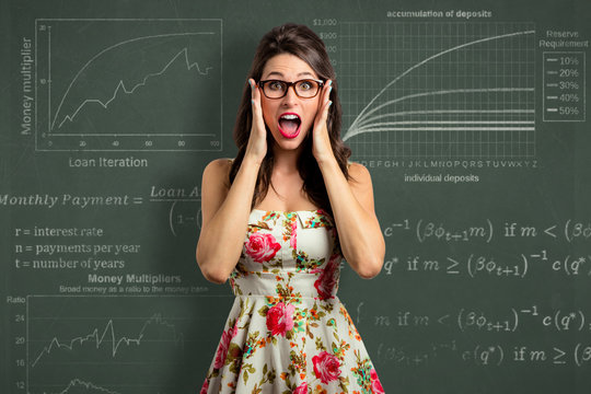 Woman investor overwhelmed by investment economy financial report math panic and stress