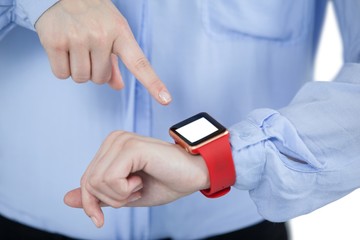 Mid section of businesswoman using smartwatch