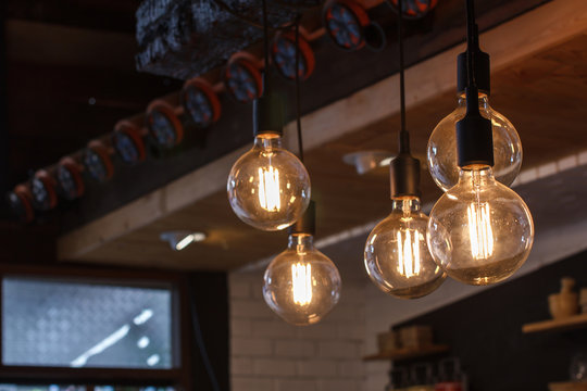 Decorative antique style filament LED light bulbs in restaurant.