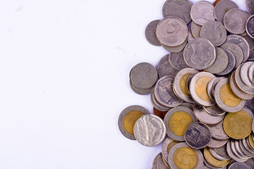 a pile of bath coins on white background finance business isolated
