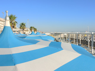 Umbrellas and gazebos on Italian sandy beaches. Adriatic coast. Emilia Romagna region.