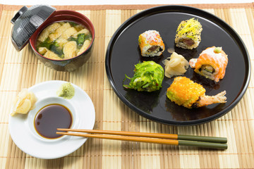 Sushi Set and sushi rolls served on wood table...