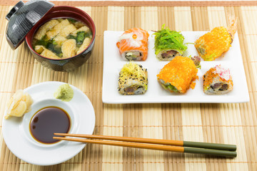 Sushi Set and sushi rolls served on wood table...