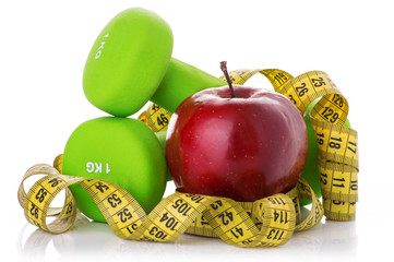 Two dumbbells, red apple, measuring tape.