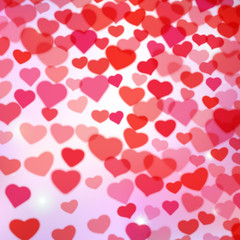 Valentines Day background with scattered blurred tender hearts