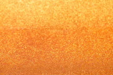 Defocused golden glitter background