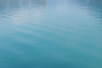 Clean and clear turquoise water in a lake in Switzerland