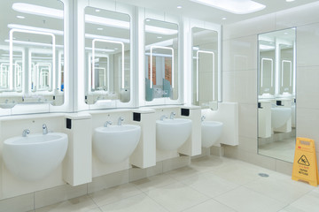 Naklejka na ściany i meble Clean public men toilet in modern international airport for service all passengers 