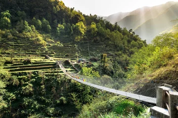 Fotobehang Annapurna Nepal. Suspension bridge in Himalayan Mountains..