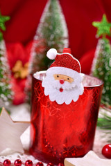 Obraz na płótnie Canvas christmas decoration with red glass candlelight