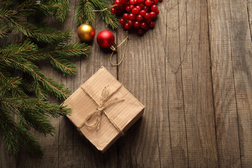 Christmas tree with gift box and decorations on wooden backgroun