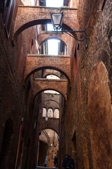 narrow street and old houses in Siena