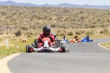 Zelfklevend Fotobehang Adult Go Kart Racers on Track © neillockhart