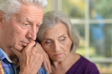Thoughtful senior couple