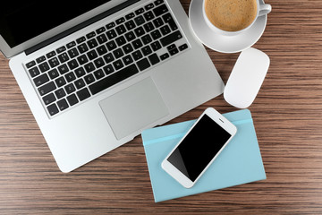 Top view of office desk with coffee and accessories