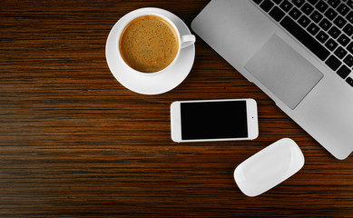 Top view of office desk with coffee and accessories