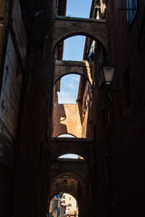 narrow street and old houses in Siena