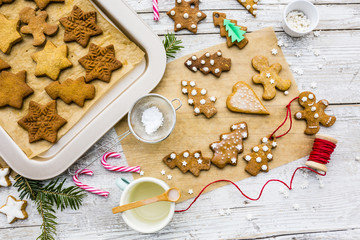 Homemade Christmas gingerbread cookies on wooden rustic background. 