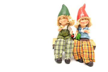 Two little vintage boy and girl resin doll on white background