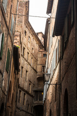 narrow street and old houses in Siena