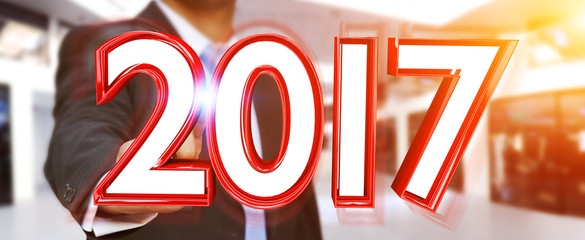 Businessman touching 2017 3D rendering text
