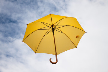 Umbrella and sky close-up.