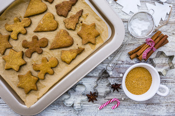 Homemade Christmas gingerbread cookies on wooden background. 