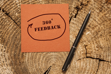 360 Degrees Feedback Concept written on paper on the wooden background. business concept