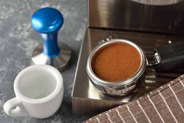 Holder with ground coffee