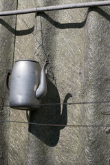 vintage kettle hang on roof background