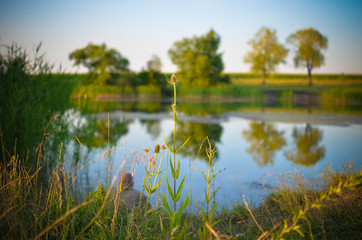 Fishman sitting at the lake