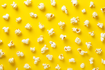 Popcorn pattern on yellow background. Top view