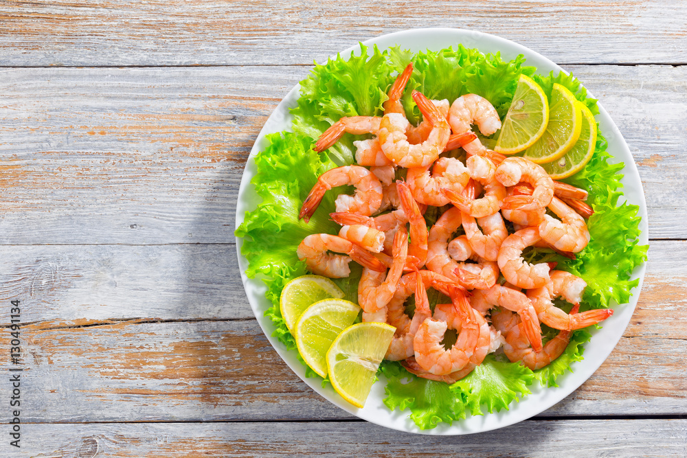 Canvas Prints salad with shrimps, green lettuce and slice of lemon