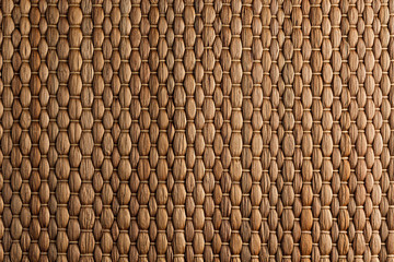 Bamboo woven brown mat handmade background. Wicker wood texture. Vertical strips.