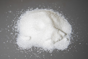 White sugar scattered on the table.