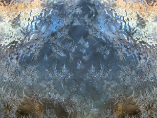 Ice pattern and sunlight on winter glass