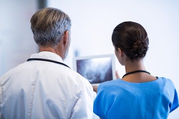 Doctor and nurse using digital tablet