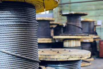 Large cable reels stocked in the factory premises.