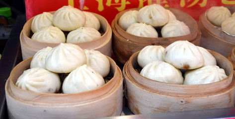 Wangfujing Snack Street. Street food booth selling specialty Chinese Steamed Dumplings in Beijing Located in Beijing, China.