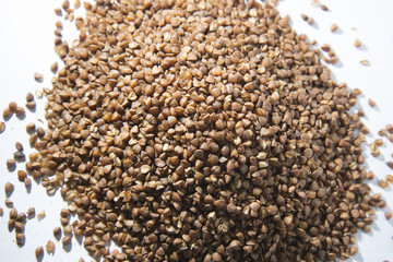 Buckwheat is scattered on the table.