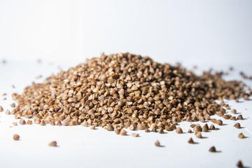 Buckwheat is scattered on the table.