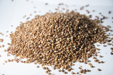 Buckwheat is scattered on the table.