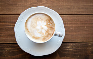 Cup of coffee on old table