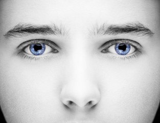 Close up image of insightful look blue human eyes