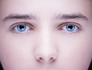 Close up image of insightful look blue human eyes