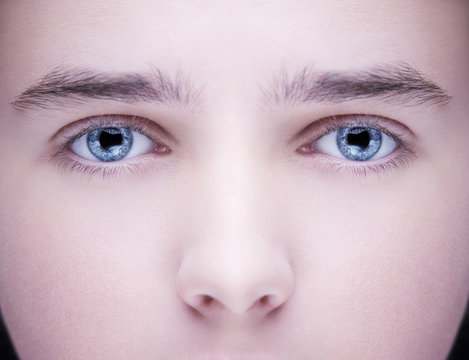 Close up image of insightful look blue human eyes