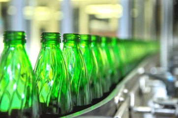 Closeup on mineral water bottles in raw and lines
