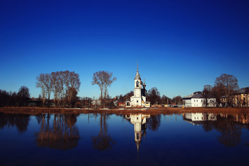 Fototapeta premium Church on the river autumn landscape in Russia